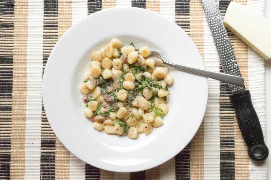 CACIO E PEPE TOASTED GNOCCHI WITH PANCETTA AND ARUGULA