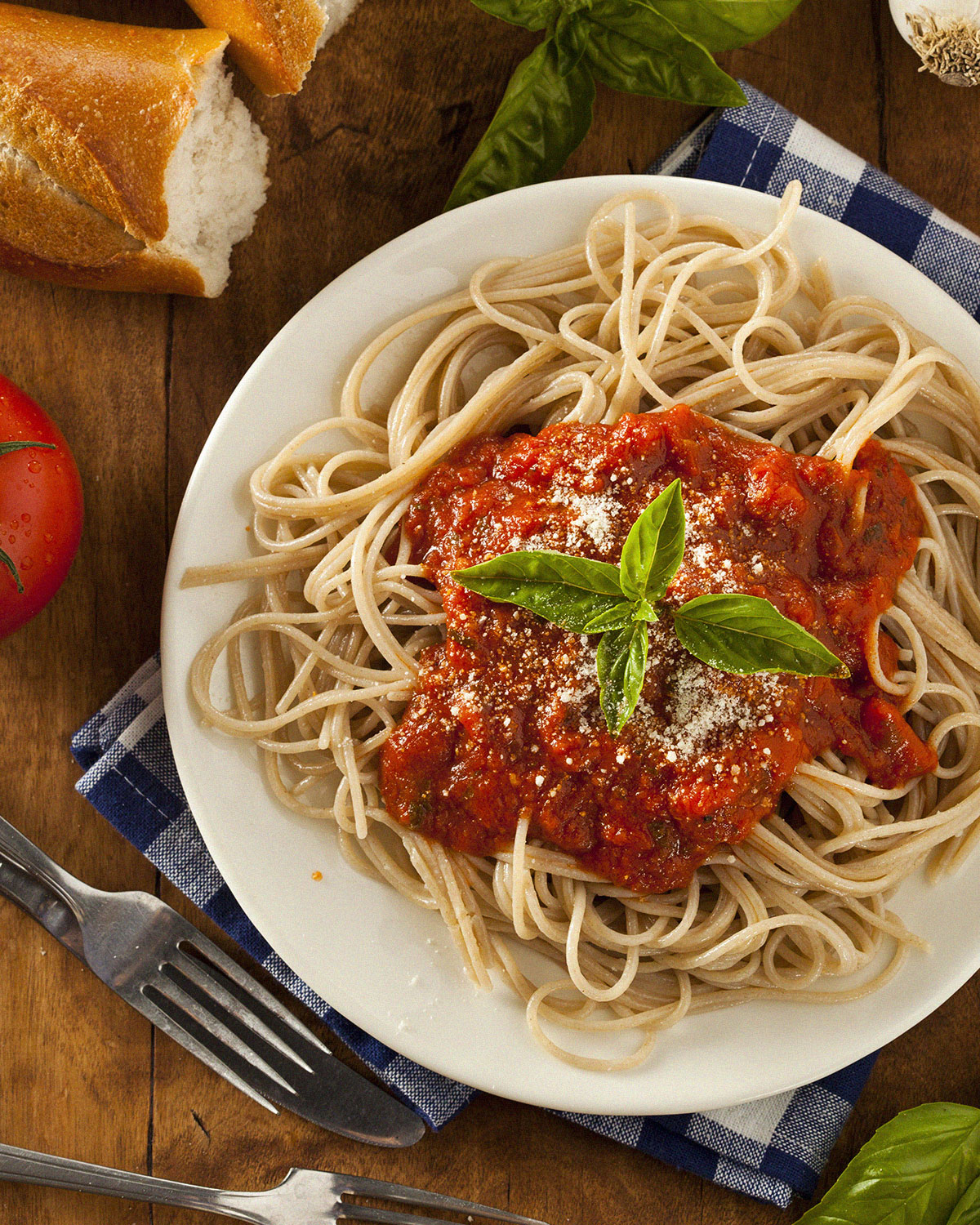 birds eye view of spaghetti with marinara sauce on table