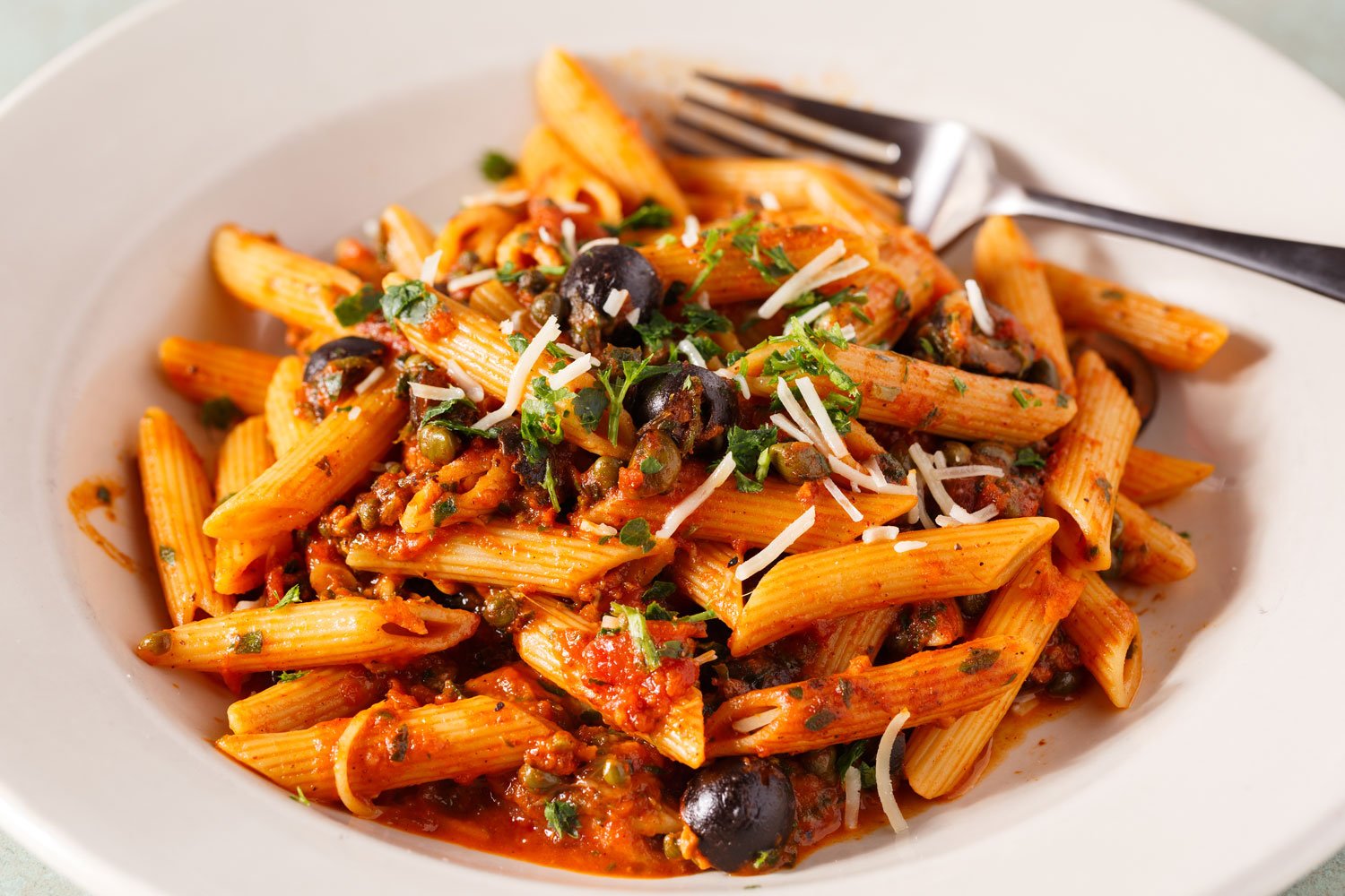 penne puttanesca on a plate