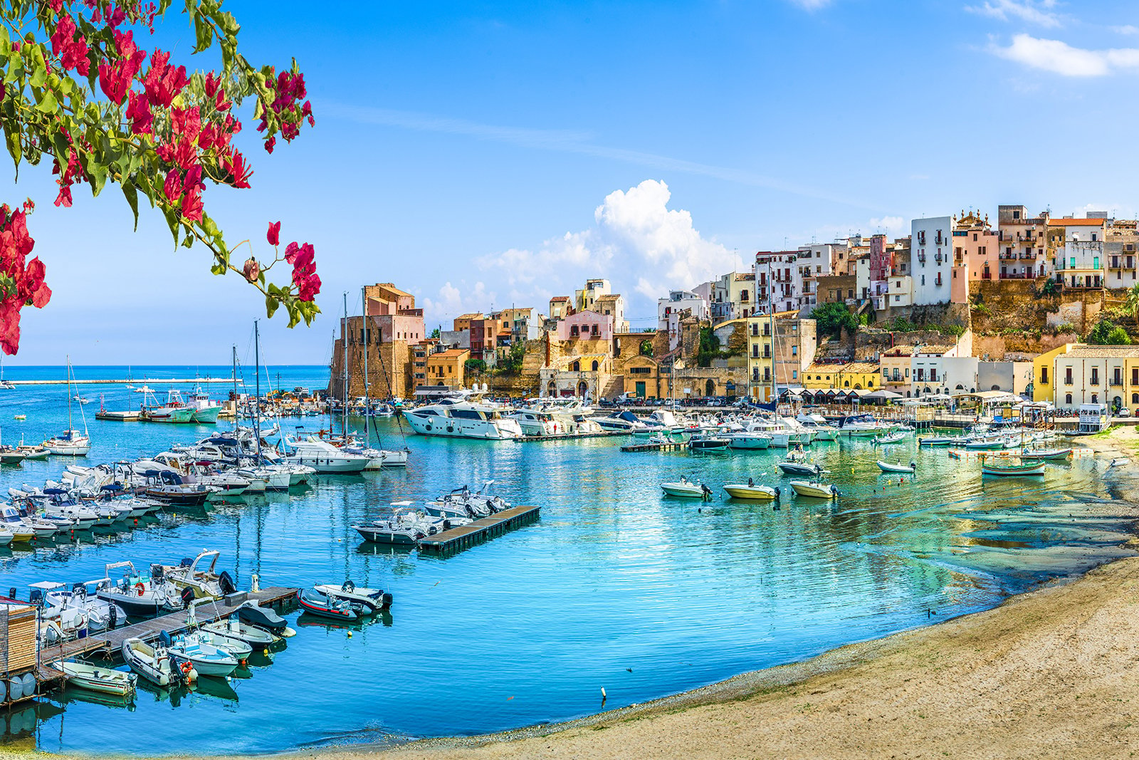 Sicily Italy landscape with water and homes in background