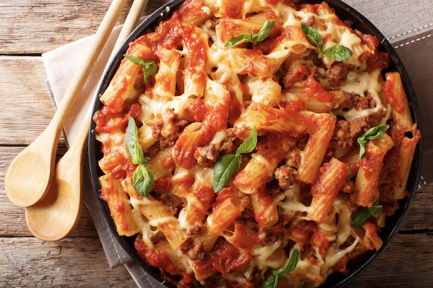 Overhead Shot of Delicious Baked Ziti on Hardwood Table